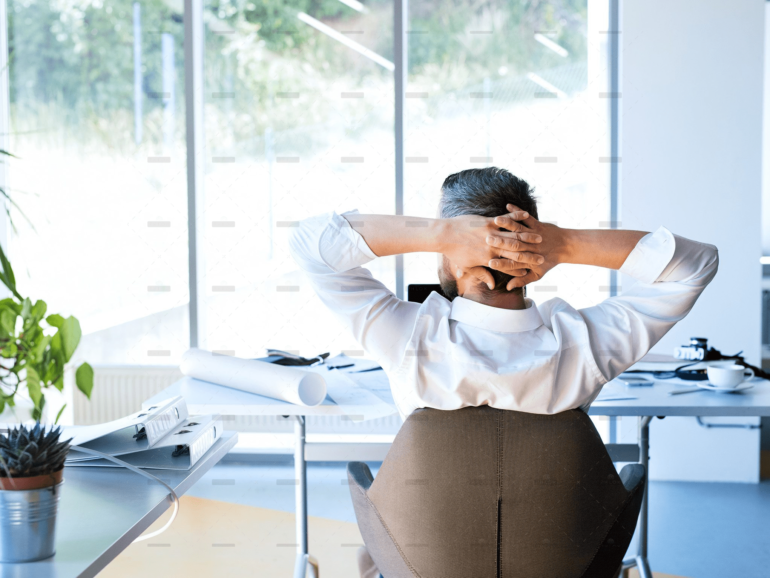demo-attachment-477-Businessman-at-the-desk-in-his-office-resting.